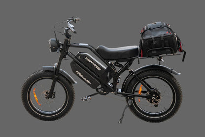 Happy Run G70 E-Bike with fat tires and rear cargo bag against gray background.