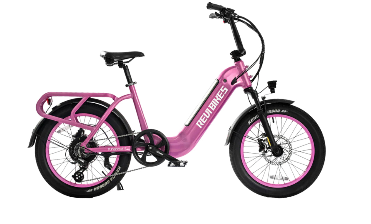 Urban E-Bike REVIBIKES® Runabout .2 with pink frame, 20” Kenda tires, and LCD display.